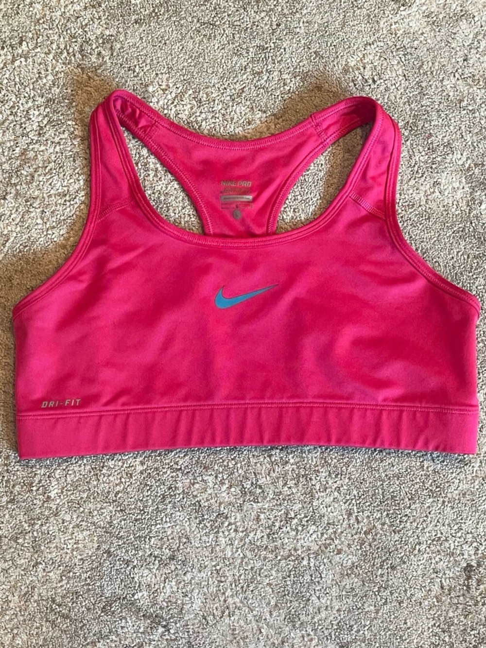 Nike Women's Bright Pink Dri-FIT Sports Bra with Blue Swoosh